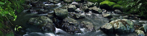Rocks with water flowing over it down a river